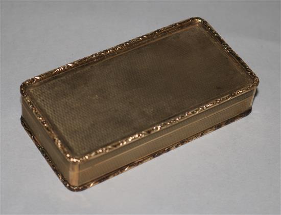 A 1960s engine turned 9ct gold rectangular snuff box, with scroll and bead edges, 107.3gms, 93mm.